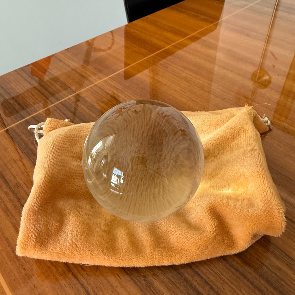 Clear Glass Crystal Ball on Soft Orange Pouch